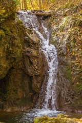 Smooth waterfall in the forest on mountain