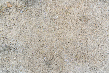 The texture of the old concrete wall with scratches, cracks, dust, crevices, roughness, stucco. Can be used as a poster or background for design. Copy space for text message.