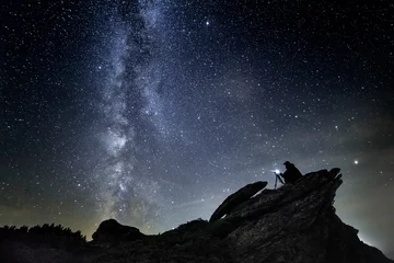 Foto op Canvas Photographer night sky in mountains with camera in tripod © losonsky