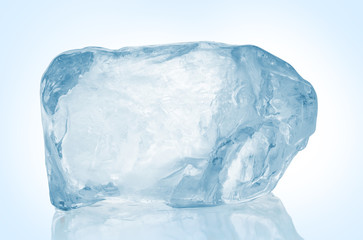 Chrystal clear frosted natural ice block in cold light blue tones on reflective surface. Clipping...