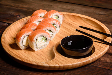 Various kinds of sushi served on a dark background