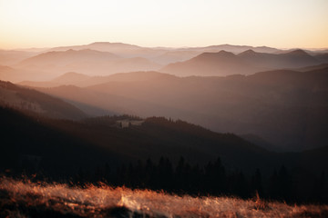 Sunrise landscape with beautiful light layers of Carpathian Mountains,Romania.