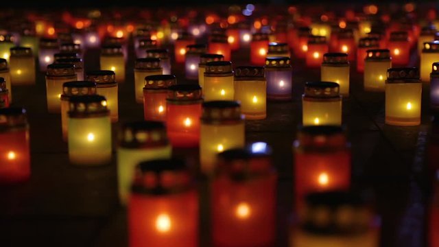 Mass Candle Light Vigil. Symbolism Of Loss and Mourning. Many burning lanterns on memory. Feeling of sadness, pain and suffering. Laterns represent the memories of loved ones. Blurred background.