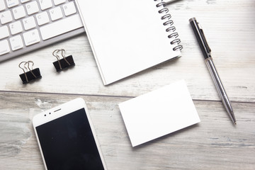 White desk office with laptop, smartphone and other work supplies with cup of coffee. Top view with copy space for input the text. Designer workspace on desk table essential elements on flat lay