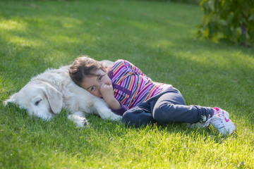 Happy child playing with dog