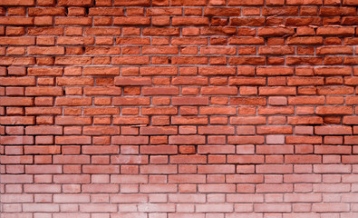 Fototapeta na wymiar grunge red weathered brick wall