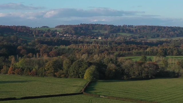 Telephoto shot of Bourton-On-The-Hill in the Cotswolds, UK. Beautiful autumnal scene with a push into the village.