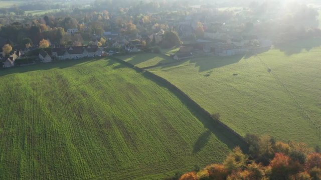 Aerial view of rural fields and footpaths in the village of Longborough, a small village near Moreton-In-Marsh in the Cotswolds Area Of Outstanding Natural Beauty, UK