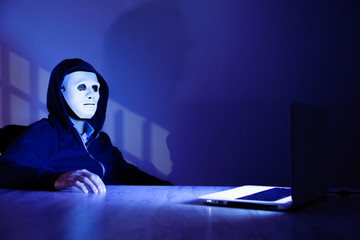 hacker working in computer on dark room