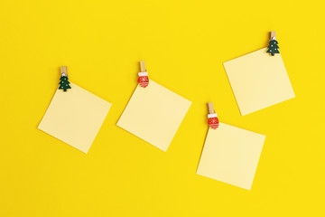 Yellow paper memo notes decorated christmas tree. Blank sticky square reminder for writing ideas, things to do.