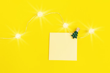 Blank paper notes for Christmas wishes for friend and colleagues. Square memo reminder yellow...