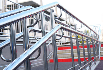Steel handrails of a modern staircase on a city street