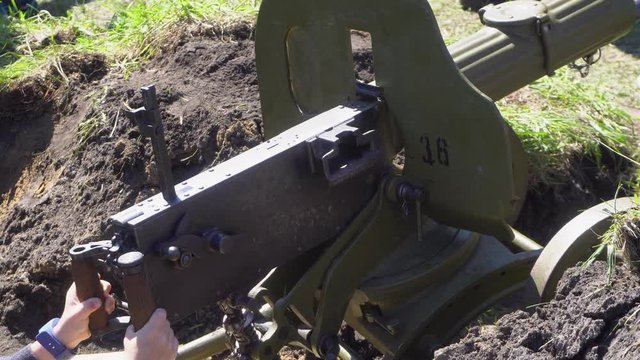 Old machine gun Maxim in a fortifying position. Strong weapon of past wars. A trench defensive structure. 4k footage.