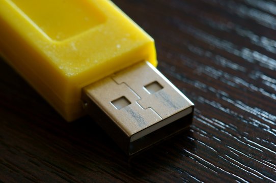 Photo Yellow USB Cable On A Dark Background.