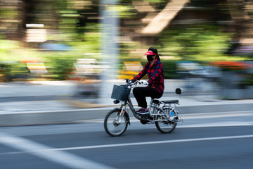 Fototapeta na wymiar Bike with slow shutter blur background 