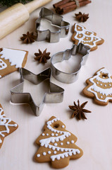 Homemade gingerbread cookies, spices and cookie cutters	