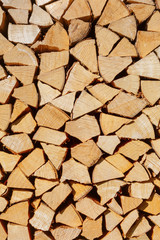 Pile of firewood. Preparation of firewood for the winter.