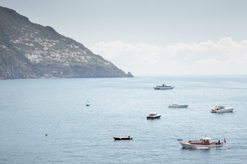 Fototapeta na wymiar small boat along the coast of italy