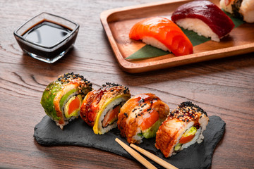 Roll and nigiri set on wooden table