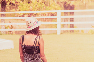 woman in hat on background of wall