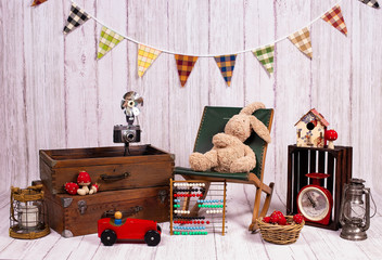 Backdrops for photo studio with vintage decor and old objects proper for kids and family photo sessions.