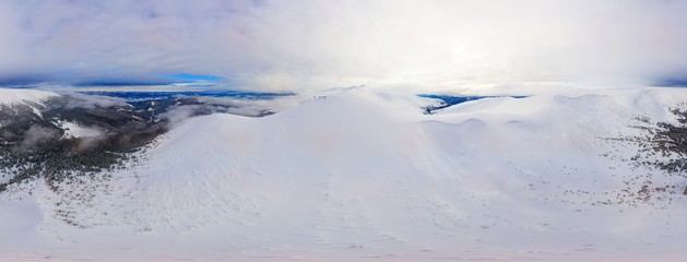 Aerial ski 360 panorama of gentle hills and mountain