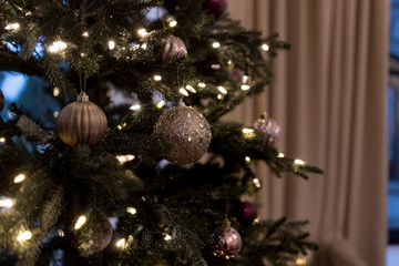 Obraz na płótnie Canvas Christmas tree close up with silver Baubles