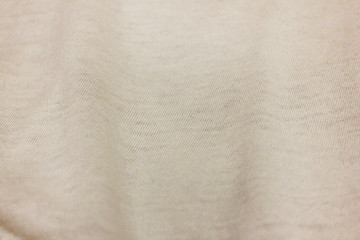 Fototapeta na wymiar Cotton pale beige fabric background, textured cloth pattern. Light white texture of casual cotton clothing 