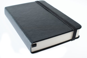 black notebook with rubber closure