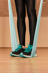 Stock photo of a young woman doing exercises with the resistance band