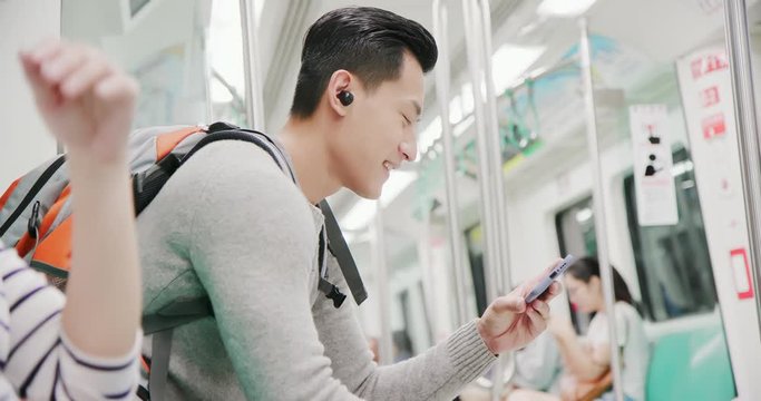 asian man wear wireless earbuds