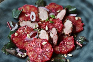 salad with red orange (blood orange), duck breast, beet top (chard), sunflower seeds, red onion....