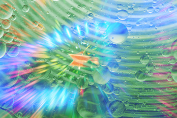 Fototapeta na wymiar Bokeh light with Oil drop on water with colerful to creation design.