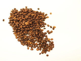 Scattered coffee beans isolated on white background. Top view with place for text.