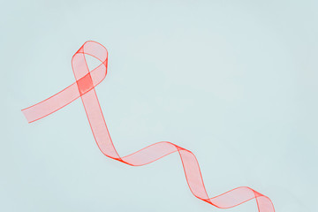 Closeup red ribbon awareness on White background for World Aids day campaign. Healthcare and medicine concept.