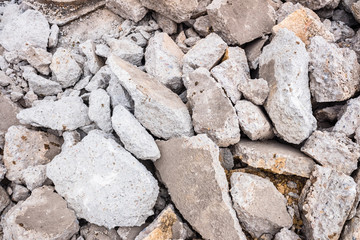 Broken cement rubble of a ruined road.