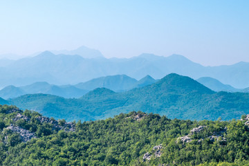 Fototapeta na wymiar Mountains of Montenegro. Green forest and haze