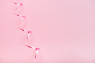 beautiful pink ribbon on bright background copy space
