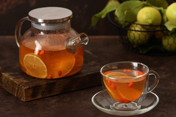 Tea of sea-buckthorn berries with lemon and orange