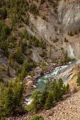 View from Above of a beautiful Green River running in the valley during a summer day. Taken near Lillooet, British Columbia, Canada.