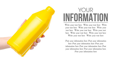 Yellow bottle industrial primer in hand on white background isolation, space for text