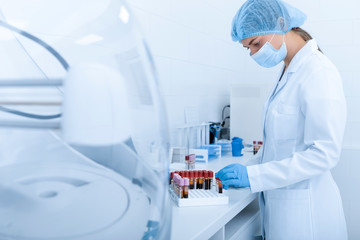 Woman collecting blood samples for testing on different diseases