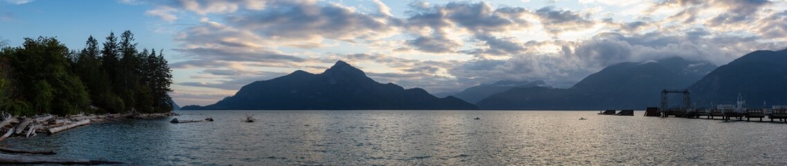 Beautiful Panoramic View of Howe Sound surrounded by Canadian Mountain Landscape during summer sunset. Taken in Porteau Cove, North of Vancouver, BC, Canada.
