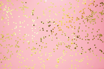 Abstract textured backgraund, golden heart shape glitter over pink background. Valentine's Day, love, birthday, party concept. Flat lay with copy space. - Powered by Adobe