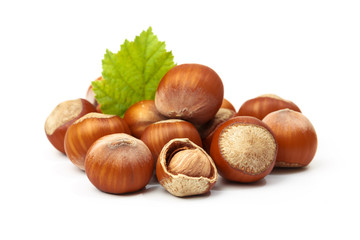 Hazelnut nut many leaves isolated on a white background as a packaging design element