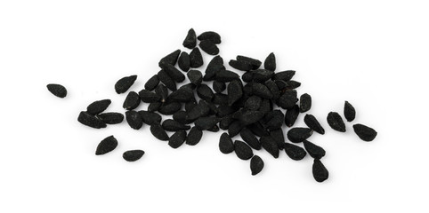 A handful of black cumin seeds. Isolated on white background.