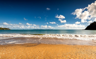 small waves on the beach in Doubtless Bay, near Taipa, New Zealand