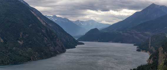 Aerial View of Anderson Lake surrounded by Canadian Mountain Landscape during a cloudy summer day. Located near Lillooet, BC, Canada.
