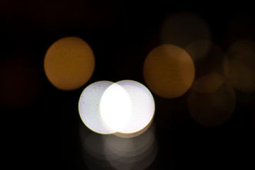 Beautiful and colorful bokeh lights on a black background - blurry backgrounds, lights at night