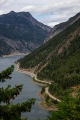 Fototapeta na wymiar Beautiful Aerial View of Carpenter Lake during a cloudy summer day. Located between Gold Bridge and Lillooet in the interior British Columbia, Canada.